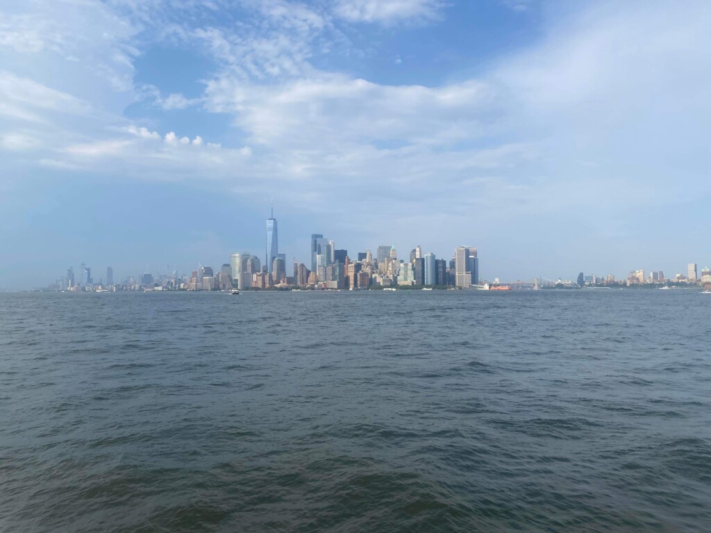 The Enchanting Manhattan Skyline: A Captivating View with the Statue of Liberty